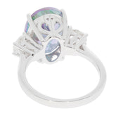 Oval Mystic Topaz Sterling Silver Ring showcasing a sparkling gemstone from the side, highlighting its elegant design.